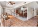 Spacious open living area with tile floors connecting a cozy seating area to a formal dining setting, great for gatherings at 6931 E Pershing Ave, Scottsdale, AZ 85254