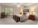 Comfortable main bedroom with a queen-sized bed, ceiling fan and a view of the outdoors at 6931 E Pershing Ave, Scottsdale, AZ 85254