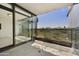 A spacious balcony with views and glass doors leading back into the unit at 7120 E Kierland Blvd # 316, Scottsdale, AZ 85254