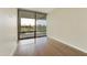 Bright bedroom featuring hardwood floors, lots of light, and balcony access at 7120 E Kierland Blvd # 316, Scottsdale, AZ 85254
