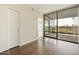Bedroom with dark hardwood floors, a closet and balcony access at 7120 E Kierland Blvd # 316, Scottsdale, AZ 85254