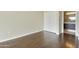 Bright bedroom features wood floors, closet with sliding doors and view into ensuite bath at 7120 E Kierland Blvd # 316, Scottsdale, AZ 85254