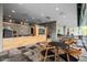 Inviting common area with a bar and kitchen area, tables, and chairs for residents at 7120 E Kierland Blvd # 316, Scottsdale, AZ 85254
