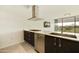 Open kitchen featuring modern appliances, gas cooktop, and views of the outdoor scenery at 7120 E Kierland Blvd # 316, Scottsdale, AZ 85254