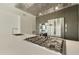 Modern kitchen with stainless steel appliances, a gas cooktop, and sleek gray cabinetry at 7120 E Kierland Blvd # 316, Scottsdale, AZ 85254