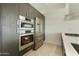 Close-up of a modern kitchen with stainless steel appliances, sleek cabinetry, and a clean design at 7120 E Kierland Blvd # 316, Scottsdale, AZ 85254