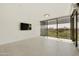 Bright living room with large windows, a view of the greenery and minimalist design at 7120 E Kierland Blvd # 316, Scottsdale, AZ 85254
