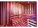 Inviting wooden sauna with benches and traditional heater, perfect for relaxation and wellness at 7120 E Kierland Blvd # 316, Scottsdale, AZ 85254