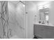 Stylish bathroom with modern vanity, square mirror, and marble-look shower at 8020 E Thomas Rd # 313, Scottsdale, AZ 85251