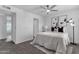 A cozy bedroom offering a ceiling fan, plush carpet, and modern design elements at 8020 E Thomas Rd # 313, Scottsdale, AZ 85251
