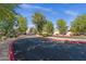 Community driveway with lush landscaping and well-maintained surroundings creating curb appeal at 8020 E Thomas Rd # 313, Scottsdale, AZ 85251