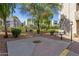 Outdoor grilling and seating area amidst lush greenery, creating a perfect space for community gatherings at 8020 E Thomas Rd # 313, Scottsdale, AZ 85251