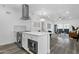Modern kitchen with stainless steel appliances, a quartz countertop island, and an open layout at 8020 E Thomas Rd # 313, Scottsdale, AZ 85251