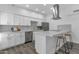 Modern kitchen with stainless steel appliances, quartz countertops, and a stylish backsplash at 8020 E Thomas Rd # 313, Scottsdale, AZ 85251