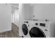 Convenient laundry room features modern appliances and a nearby doorway at 8020 E Thomas Rd # 313, Scottsdale, AZ 85251