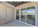 Covered patio area features sliding glass doors opening to living area at 8020 E Thomas Rd # 313, Scottsdale, AZ 85251