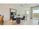 Cozy dining area with a round table, plush chairs, and abundant natural light at 8149 E Petunia Ave # 1060, Mesa, AZ 85212