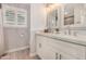 Bathroom featuring stylish mirrors, granite counters, and modern decor at 8713 E Citrus Way, Scottsdale, AZ 85250