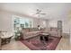 Cozy living room showcasing ample natural light, a ceiling fan, and a comfortable, oversized sectional sofa at 8713 E Citrus Way, Scottsdale, AZ 85250