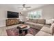 Inviting living room featuring a plush sectional sofa, modern entertainment center, and stylish decor at 8713 E Citrus Way, Scottsdale, AZ 85250