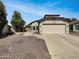 Charming single-story home featuring a well-maintained yard and a two-car garage at 8831 N 63Rd Dr, Glendale, AZ 85302