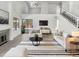 Bright living room with vaulted ceilings, fireplace, and open floor plan at 8831 N 63Rd Dr, Glendale, AZ 85302