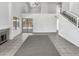 Spacious living area featuring tile floors, a fireplace, and access to the backyard at 8831 N 63Rd Dr, Glendale, AZ 85302