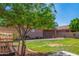 Expansive backyard features a lush lawn and mature tree at 9 S 195Th Ln, Buckeye, AZ 85326
