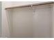 This closet has a wood clothing rod and white walls at 9 S 195Th Ln, Buckeye, AZ 85326