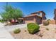 Two-story home with tile roof, desert landscaping, and a two car garage at 9 S 195Th Ln, Buckeye, AZ 85326