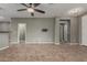Spacious living area features tile floors, neutral walls, and access to the kitchen at 9 S 195Th Ln, Buckeye, AZ 85326