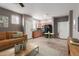 Inviting living room with a cozy sofa and a view into the eat-in kitchen at 9 S 195Th Ln, Buckeye, AZ 85326