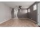 Spacious living area featuring tile flooring, modern ceiling fan and neutral colored walls at 9 S 195Th Ln, Buckeye, AZ 85326