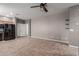 Neutral living space with ceiling fan and tile flooring at 9 S 195Th Ln, Buckeye, AZ 85326