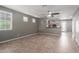 Spacious and well-lit living room with neutral walls leading into an open concept kitchen at 9 S 195Th Ln, Buckeye, AZ 85326