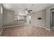 Cozy living room features neutral walls, tile flooring, and an open view to the kitchen at 9 S 195Th Ln, Buckeye, AZ 85326