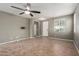 Light filled living room with tile floors, recessed lighting and a ceiling fan at 9 S 195Th Ln, Buckeye, AZ 85326