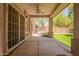Covered back porch with a view of a hot tub and backyard at 941 N Benson Ln, Chandler, AZ 85224