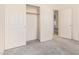 A view of a bedroom with an open closet and open door looking into another room at 941 N Benson Ln, Chandler, AZ 85224