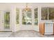 Cozy dining area with bay window, chandelier, and view of fountain and green space at 941 N Benson Ln, Chandler, AZ 85224