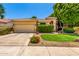 Charming single-story home featuring a well-manicured lawn, desert landscaping, and a neutral-toned exterior at 941 N Benson Ln, Chandler, AZ 85224
