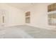 Bright living room with carpet flooring and large windows at 941 N Benson Ln, Chandler, AZ 85224