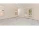 Living room featuring neutral carpet, a ceiling fan, and lots of natural light at 941 N Benson Ln, Chandler, AZ 85224