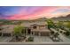 Stunning aerial view of a desert home, showcasing the community, mountains, and desert landscape at 11124 N 138Th Way, Scottsdale, AZ 85259
