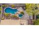 Aerial view of backyard pool, spa and outdoor seating area with desert landscaping at 11124 N 138Th Way, Scottsdale, AZ 85259