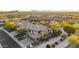 Expansive aerial view showcasing this desert home and community with mature trees and lush desert landscaping at 11124 N 138Th Way, Scottsdale, AZ 85259