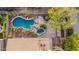 Aerial view of backyard pool, spa and outdoor seating area with desert landscaping at 11124 N 138Th Way, Scottsdale, AZ 85259