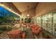 Relaxing outdoor patio featuring comfortable seating, a ceiling fan, and serene garden views at 11124 N 138Th Way, Scottsdale, AZ 85259