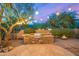 Stone patio with custom outdoor kitchen and built in barbeque at 11124 N 138Th Way, Scottsdale, AZ 85259