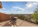 This cozy balcony features wrought iron seating and a stunning view of the surrounding landscape at 11124 N 138Th Way, Scottsdale, AZ 85259
